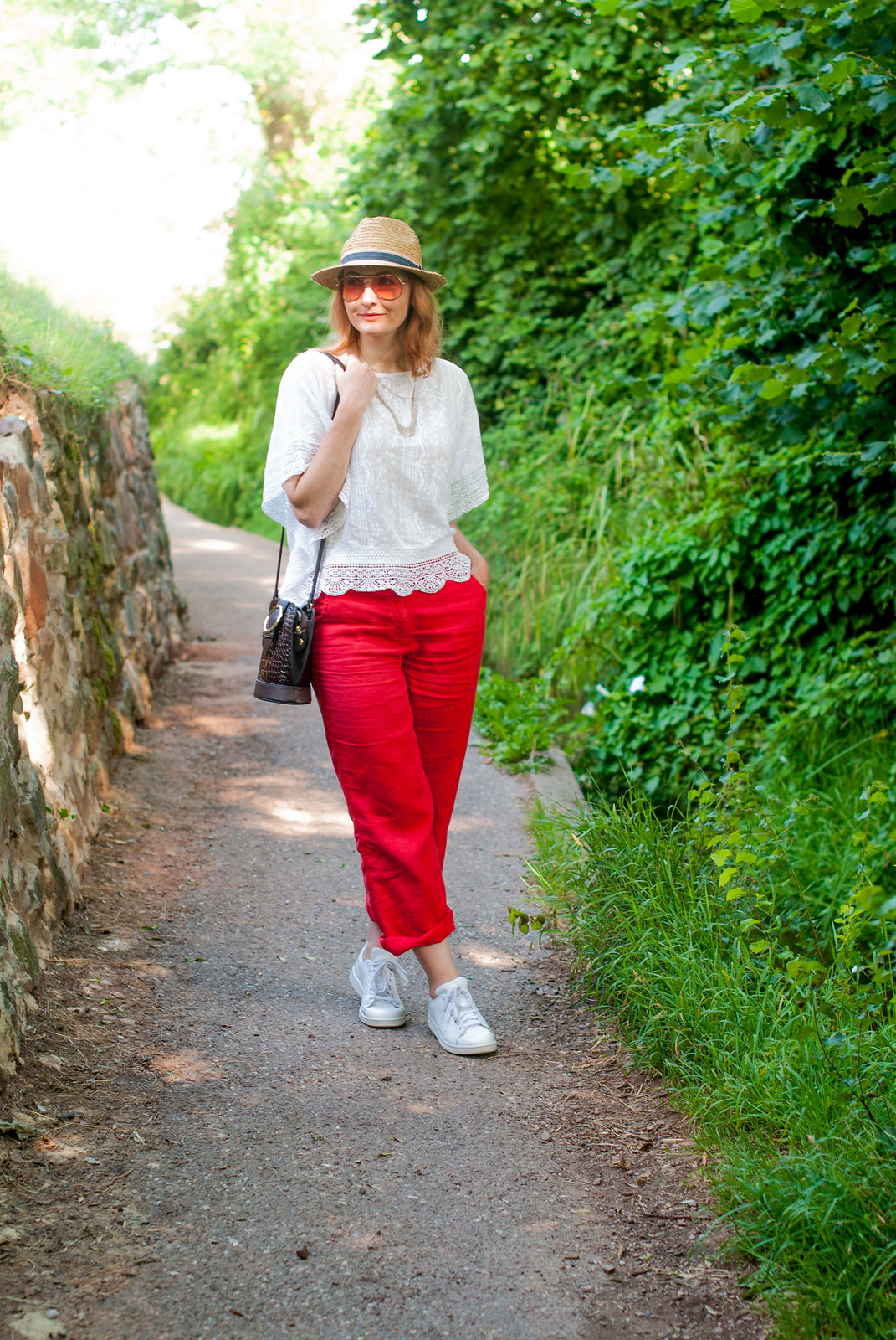 Red and white: A bold summer combination loose white lace top red wide leg linen pants straw hat white Adidas Stan Smiths orange tint aviator sunglasses | Not Dressed As Lamb, over 40 style