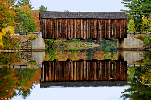 road street old bridge autumn red orange usa brown reflection building tree green fall water yellow river catchycolors landscape outside gold photo leaf interesting nikon flickr exterior image shots outdoor country picture newengland newhampshire engineering places whitemountains nh foliage infrastructure coveredbridge scenes gundersen livefreeordie nikoncamera nikond40x d40x bobgundersen robertgundersen