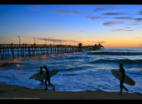 imperialbeach pier ocean sunset summer sport silhouette water surf surfing surfboard beach surfer recreation people travel sea tropical nature fun vacation board lifestyle colorful holiday sun sand wave male tourism adventure sky men active pacific healthy man outdoor watersport idyllic seashore walking warm weather watersports scenic shorebreak tranquil standing beautiful samantoniophotography
