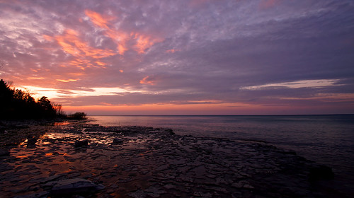 sunset waterfr water beach weather rocks sunrise