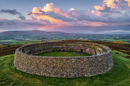 grianan aileach lough swilly foyle ancient irish kings hill lookout fort ring ringed burt county donegal ireland summer landmark stone monument tourist site famous visit scenic countryside druid celtic gareth wray photography inishowen derry londonderry an angrainan sun inch island historic aerial drone dji phantom 4 p4p pro quadcopter heather national gaelic photographer garethwrayphotography vacation holiday europe fahan buncrana sunset kingdom architecture landscape