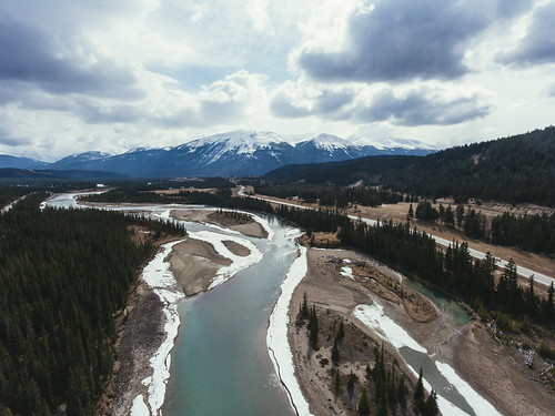 jasper alberta canada ca national park drone arial helicopter trees above top down river nature back country