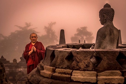 central java indonesia buddhist monk praying sunrise borobudur nagajohn