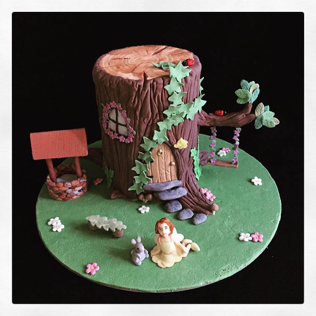 An Enchanted Fairy House and Garden Cake by Top This Cake - Toppers for cakes and cupcakes