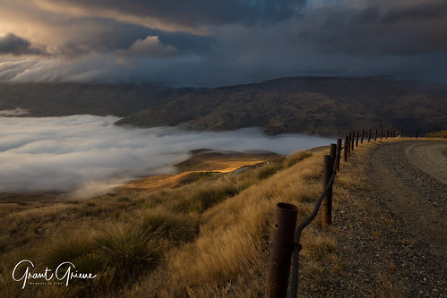 dawn sunrise mountains cloud sun hills grass curves mist highlight landscape fence goldenhour golden