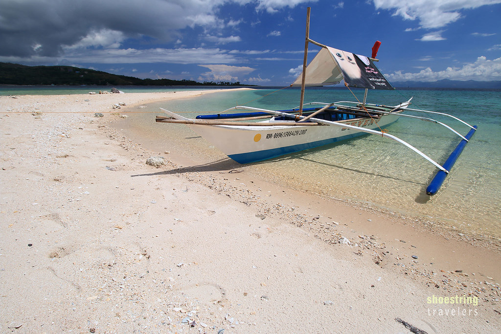 boat at Logbon Island's sandbar