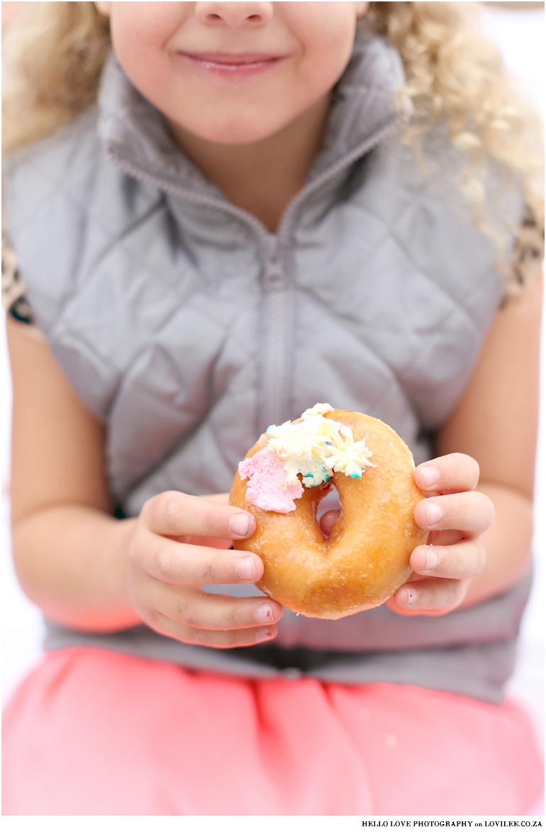Girl holding doughnut