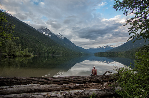 noperson water mountain landscape lake nature travel outdoors wood sky scenic tree reflection valley summer park bc britishcolumbia canada peaceful man edge sitting contemplating mountains clouds dramatic camping pemberton