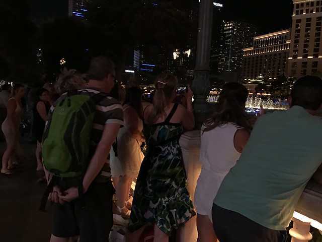tourists watch fountain show
