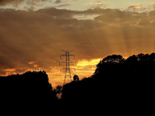 tower power electricity highvoltage transmission wires sunset clouds orange radiant dusk evening pennsylvania fayettecounty wheeler silhouette hillside hilltop nature outdoors light rays