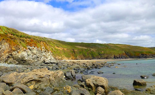 coast sea cliffs cornwall england uk beach sand rocks clouds