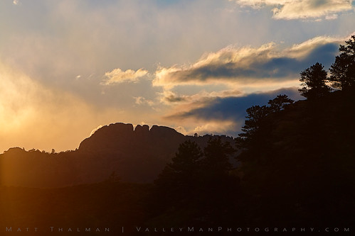 colorado horsetoothmountain clouds fortcollins glow hazy landscape mountain orange shadow silhouette sky sunset trees
