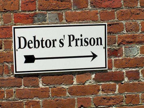 arrow sign apostrophe brick prison