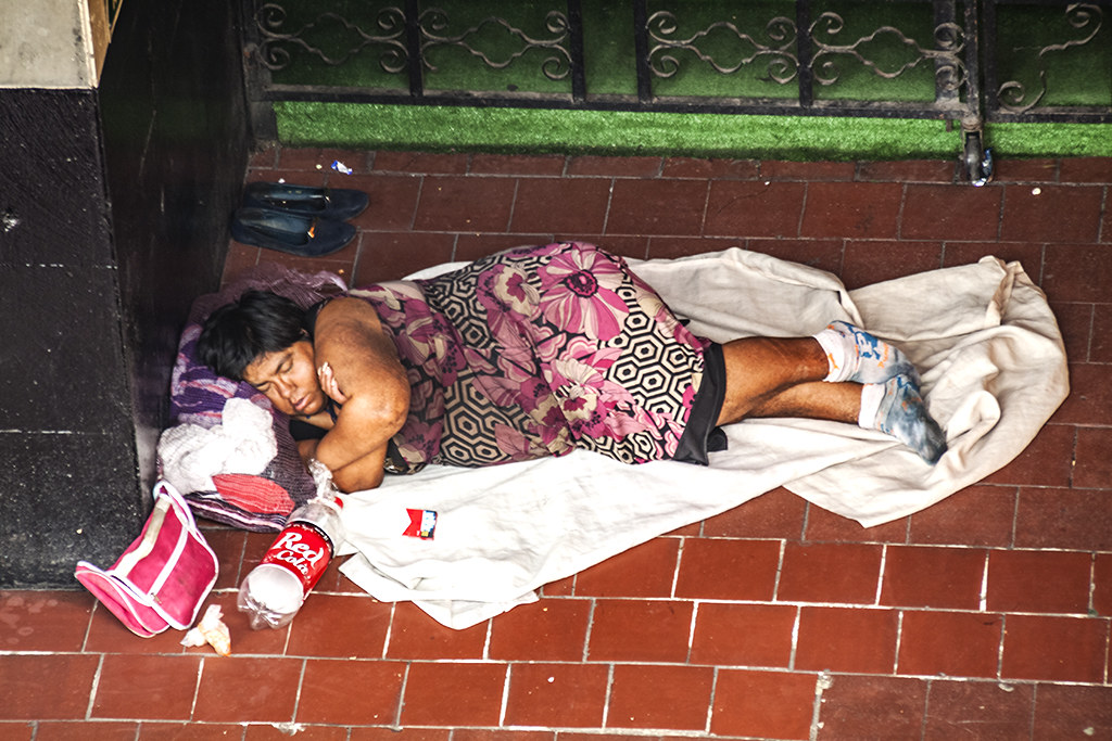 Woman sleeping on edge of Garibaldi Plaza--Mexico City