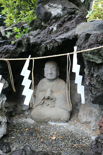 Statue of an ascetic in a cave on a mini-Fuji in Tokyo