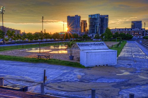baltimore md maryland innerharbor sunrise morning clouds sky colorful dawn twilight rashfield beach volleyball puddle flooded sunflare harboreast courts sand hdr highdynamicrange