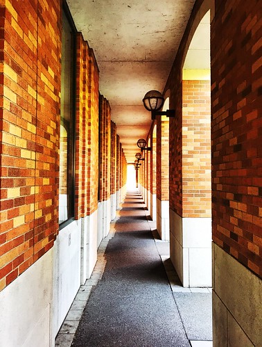 washington shotoniphone universityofwashington iphone7 corridor repetition wall brick red orange sunset color light tunnel