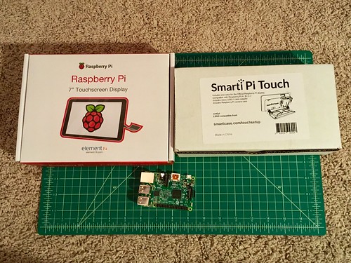 Raspberry pi in a Smartipi Touch case with touchscreen display in boxes