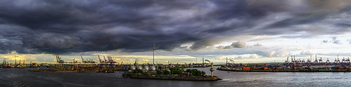 panorama hamburg germany cityscape harbour elbe river cranes clouds dark sky