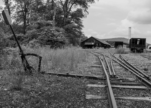 nikon d90 amateur handheld summer june 2017 eastbroadtop eastbroadtoprailroad ebt rail railroad heritage historic antique relic abandoned neglected rusty crusty rust crust dirty orbisonia pa pennsylvania rockhill rockhillfurnace train trains bw blackwhite blackandwhite desaturated buildings exterior outside nikkor 18200mm switch threeway unique rails track tracks ballast metal steel iron rollingstock shops trees grass triplestubswitch railroadswitch narrowgauge explore flickrexplore