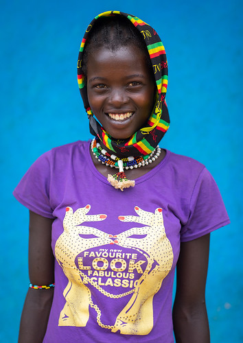 abyssinia africa beautify bluebackground bluewall closeup colorful eastafrica ethiopia ethiopia0617253 ethiopianethnicity ethnic ethnology girl hamerbenaworeda headshot hornofafrica jewel jewelry keyafer lookingatcamera modernityandtradition multicoloured omo omovalley onepersononly oneteenagegirlonly paintedwall portrait purple scarf smiling snnpr teenager tradition traditionalclothing tribal tribe tribeswoman vertical waistup wall young youth et