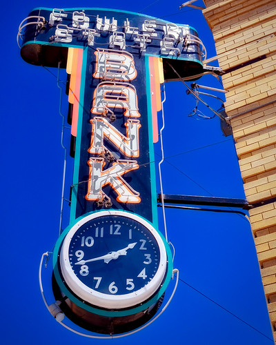 colorado bank maney cash neon sign clock time save small town city