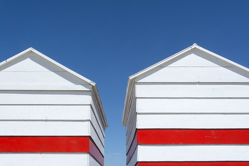 Two beach huts with red stripes