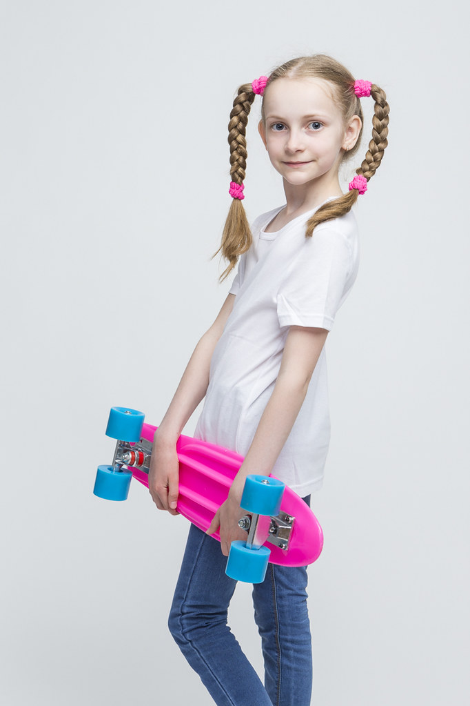 Little Caucasian Blond Girl with Nice Pigtails Posing With Pink Pennyboard ...