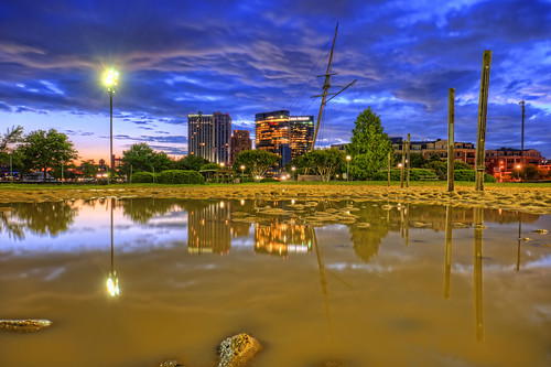 baltimore md maryland innerharbor sunrise morning clouds sky colorful dawn twilight rashfield beach volleyball puddle skyline skyscrapers buildings reflection harboreast flooded courts sand hdr highdynamicrange