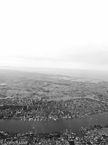 black white retro nyc new york city view views fly flying plane airplane planes buildings sky water skyscrapers skyline horizon