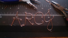 What do you think of these wire letters? I've been working on wire letters recently, thinking of making them into pendents. So far, they are shaped and hammered. These are made with rose gold wire. I've made an 