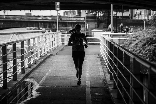 monochrome people urban street candid portrait streetphotography candidstreetphotography streetlife eyecontact candideyecontact shadowplay urbanlandscape woman female girl face ponytail running sport exercise action motion movement backlit silhouette puddle water reflection river bridge tone texture detail depth naturallight outdoor light shade shadow shadows city scene human life living humanity fitness society culture canon canon5d 5dmarkiii telephoto composition framing ef70200mmf28lisiiusm black white blackwhite bw mono blackandwhite glasgow scotland uk riverclyde