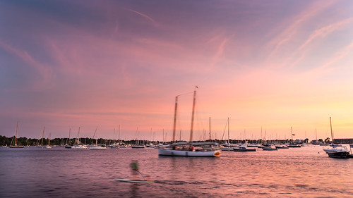newportrhodeisland newport rhodeisland boats water man sunset colorful color sky clouds eastcoast ocean river spring sunny sun evening