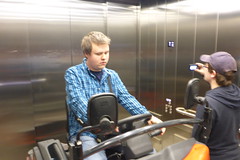 Alex on a cart in an elevator