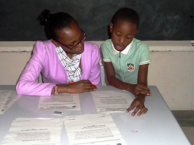 Madam Jane supervises oral English examination