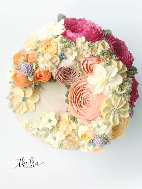 Buttercream Floral Crescent by The KU Cakery