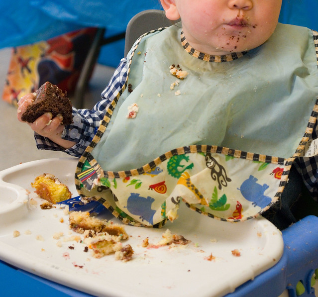 Infant eating chocolate sauerkraut cake