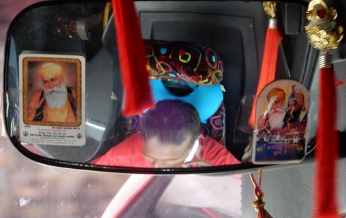 malaysia bus trip driver phone illegal dangerous mirror tassles guru hindu