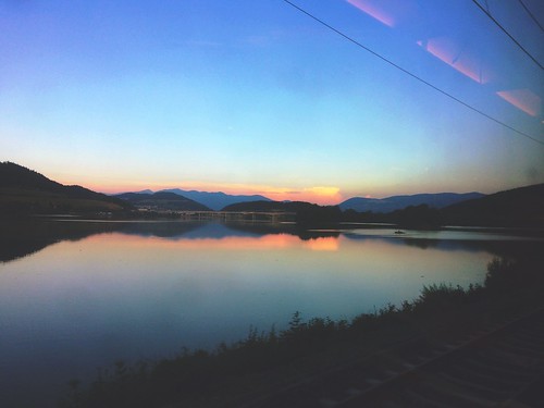 everyweek view lights magic europe travel shadow forest hills wires clouds sky mirror colors nature endoftheday evening trip iphone slovakia coach train rails sunset bridge lake water window outside