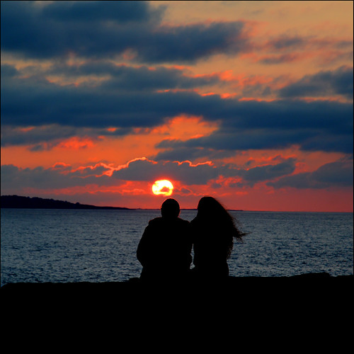 doolin sunset clare ireland sky red orange people clouds silhouette couple romance romantic lovers