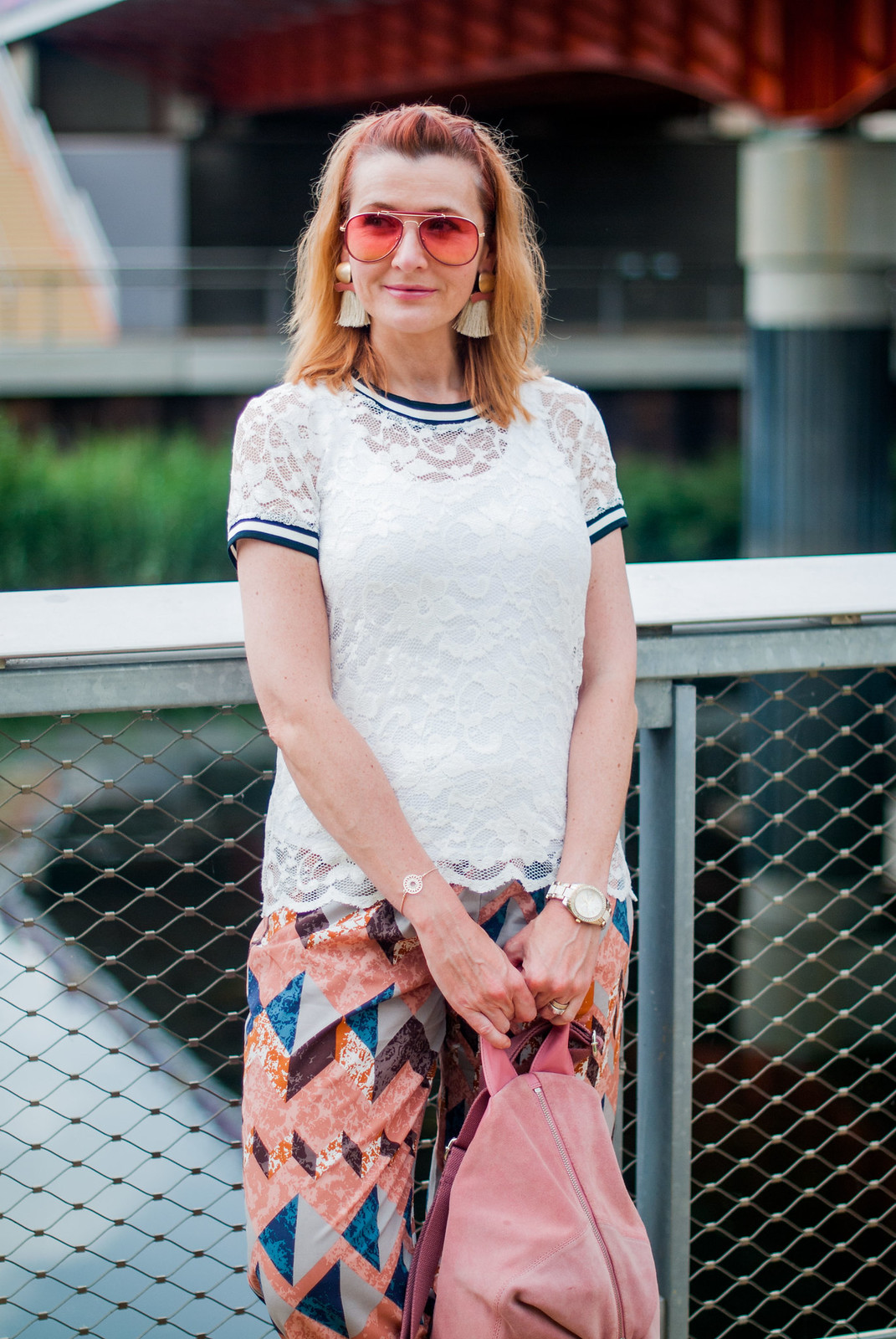 Bold, colourful summer dressing: White lace top pyjama-style patterned trousers pants white Stan Smiths statement tassel earrings orange aviators pink suede backpack | Not Dressed As Lamb, over 40 style blog