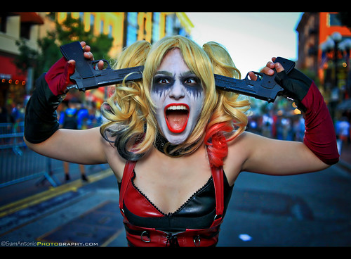 harleyquinn suicidesquad woman makeup female harlequin harley shooting model quinn cosplay cartoon comic blonde costume cosplayer expression red background dangerous gun corset sideponytail standingoutofthecrowd posing suicide blondehair caucasian portrait samantoniophotography sdcc sdcc2017