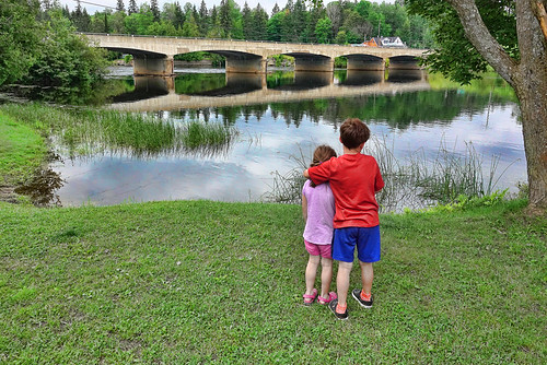boy girl bridge river summer hug siblings