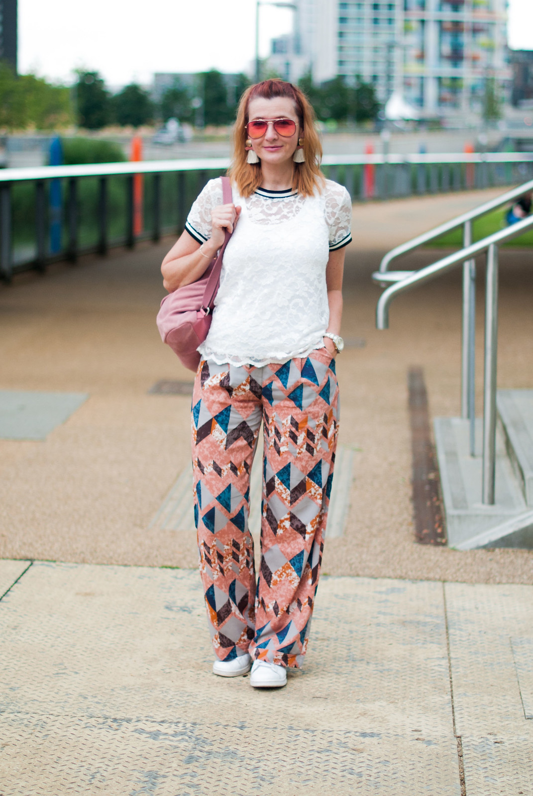 Bold, colourful summer dressing: White lace top pyjama-style patterned trousers pants white Stan Smiths statement tassel earrings orange aviators pink suede backpack | Not Dressed As Lamb, over 40 style blog