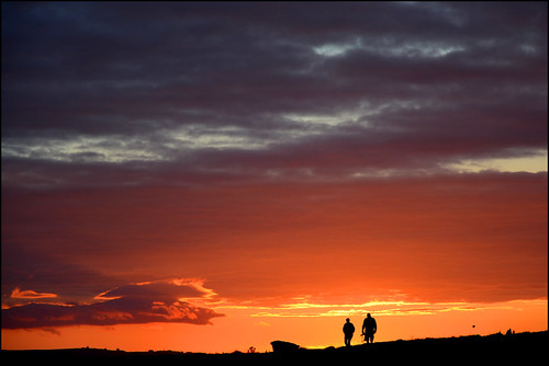 doolin sunset clare ireland sky red orange people clouds silhouette