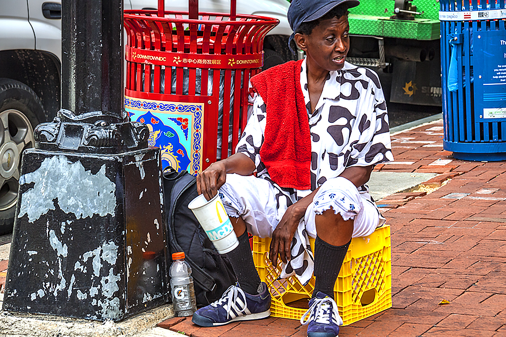 Woman begging on sidewalk in Chinatown--Washington