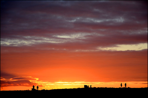 doolin sunset clare ireland sky red orange people clouds silhouette fish fishing