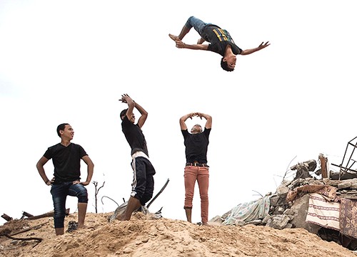 Photo: Boys practice ‘parkour,’ athletic maneuvers around obstacles, in Gaza. ©UNICEF/NYHQ2014-2063/Romenzi