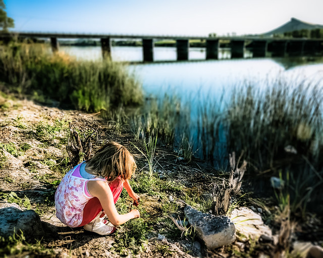 child by waterside