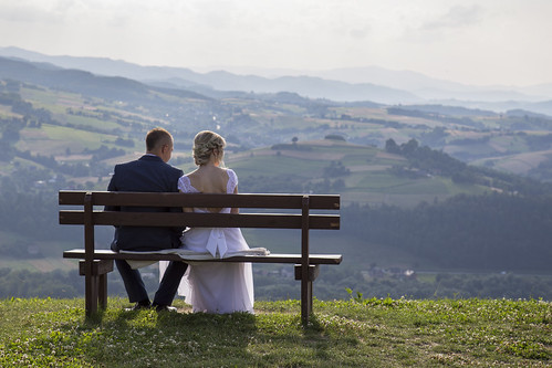 newlyweds landscape view mountains bench couple young
